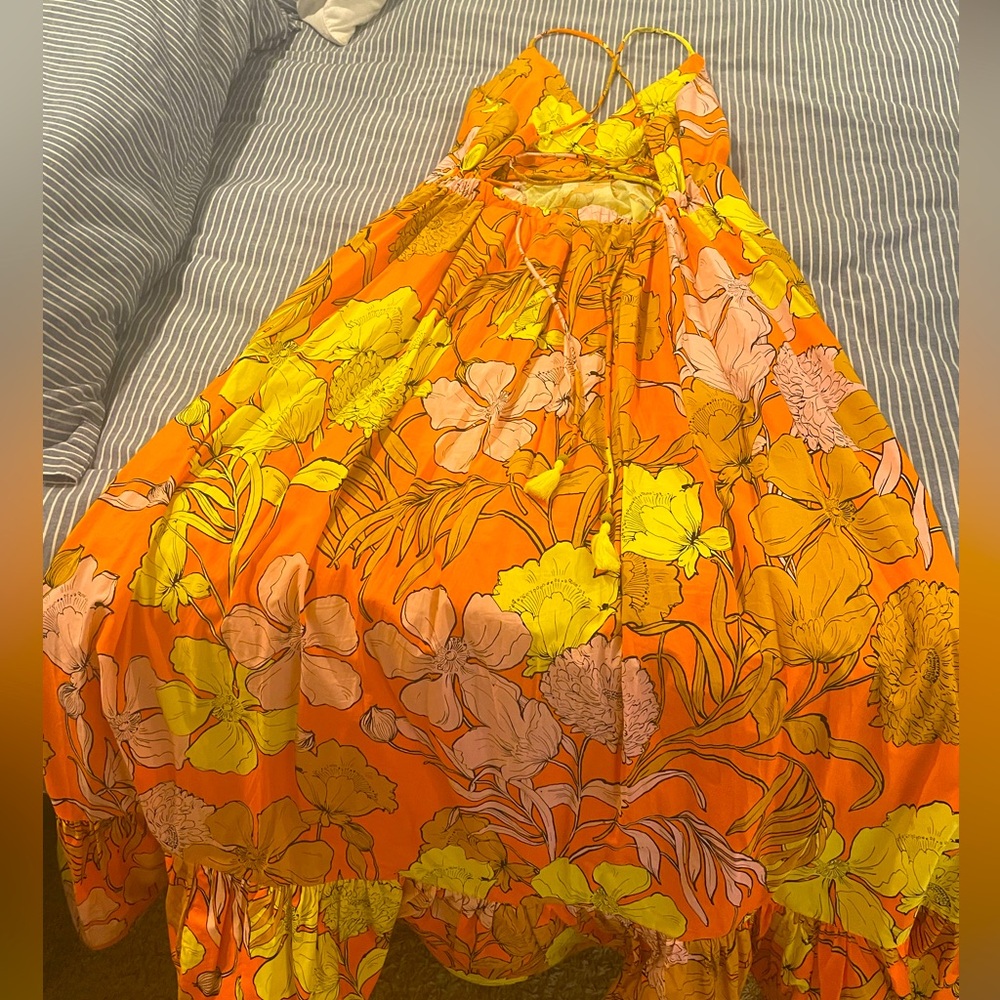 Cotton sun dress, orange with yellow and pink flowers.